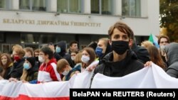 Students attend an opposition rally to reject the presidential election results, near the Belarusian State University in Minsk on October 26, 2020. 