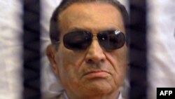 Egypt -- Former president Hosni Mubarak sitts inside a cage in a Cairo courtroom, 02Jun2012