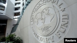 U.S. - The International Monetary Fund logo is seen inside its headquarters at the end of the IMF/World Bank annual meetings in Washington, U.S., October 9, 2016.