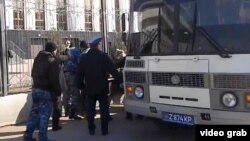 Kazakh police detain protesters against the confiscation of their land by the state in Astana on April 15.