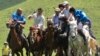 KYRGYZSTAN -- Mounted Kyrgyz riders play the traditional central Asian sport Kok-boru, know also as Buzkashi or Ulak Tartis ("goat grabbing"), during a folk festival at Kyrgyz Chon-Kurchak valley, June 17, 2017