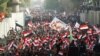 Supporters of Iraqi Shi'ite cleric Muqtada al-Sadr shout slogans during an anti-Turkey protest in front of the Turkish Embassy in Baghdad on October 18.