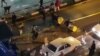 Iran -- A handout video released by Iran's Mehr News agency reportedly shows a group of men pushing traffic barriers in a street in Tehran on December 30, 2017.