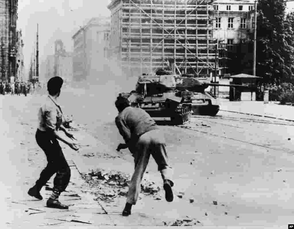 Germans throwing rocks against Soviet T-34 tanks on Leipziger Strasse, East Berlin, June 17, 1953.