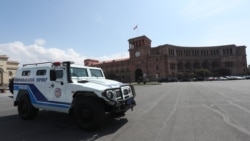 Armenia -- A police vehicle parked outside the Armenian government headquarters at Yerevan's deserted Republic Square, March 25, 2020.