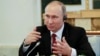 Putin Says 'Patriotic' Hackers Could Target Russia's Critics, Denies State Involvement