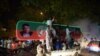 Supporters of Pakistan's cricketer-turned-politician Imran Khan, head of the Pakistan Tehreek-e-Insaf (Movement for Justice) party, celebrate on a street during the general election in Islamabad late on July 25.