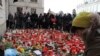 Mourners place candles outside Prague Castle as they await the arrival of the hearse carrying the late Czech President Vaclav Havel.