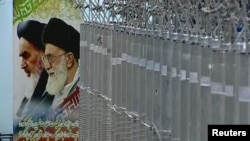 Posters of Iran's former and present Supreme Leaders hang near a bank of uranium enrichment centrifuges at the Natanz facility.