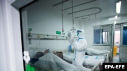 Medical staff at a Wuhan hospital, which specializes in the treatment of coronavirus.