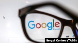 RUSSIA -- Glasses in front of a computer screen shows a Google sign - generic
