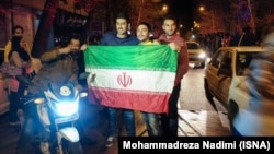 Tehran residents celebrate news of the potential nuclear agreement between Iran and world powers on April 2.