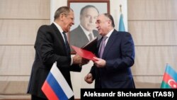 AZERBAIJAN -- Russian Foreign Minister Sergei Lavrov (L) and Azerbaijani Foreign Minister Elmar Mammadyarov exchange documents during a signing ceremony in Baku, November 3, 2019