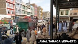 FILE: People survey the scene of a bomb blast in Quetta on April 12.