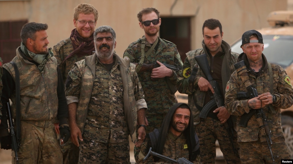 Syrian Democratic Forces (SDF) fighters pose near Raqqa (file photo).