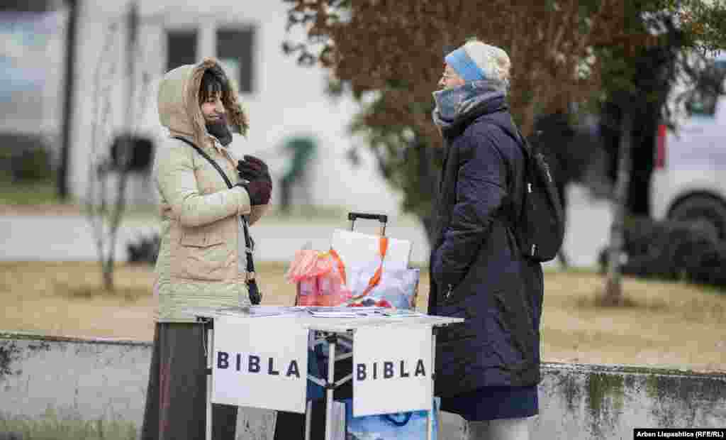 Women at a stand displaying Bibles in Prizren. Christians in Kosovo are a small minority, with around 95 percent of the population identifying as Muslim. (Photo by Arben Llapashtica)