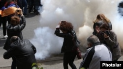 Armenia - Police fire a stun grenade at protesters in Yerevan, 22 April 2018.