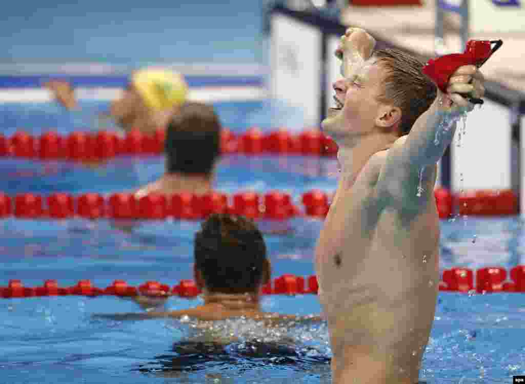 Adam Peaty of Britain celebrates breaking his own world record &ndash; for the second time in two days &ndash; and winning gold in the men&#39;s 100-meter breaststroke final. Peaty became the first British male swimmer to win Olympic gold in 28 years.
