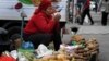 A woman sells her wares ar a market in the Kyrgyz capital, BIshkek. According to analysts, tumbling oil prices and the coronavirus crisis could wreak havoc with Central Asia's fragile economies. (file photo) 