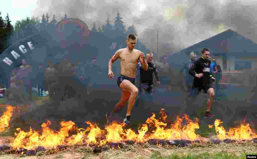 Participants take part in an extreme run "Bison race" near the town of Logoisk, Belarus. (Reuters/Vasily Fedosenko)