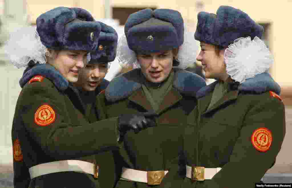 Belarusian girls attend an honor guard ceremony, which is part of the state patriotic education program and preparations for the upcoming Victory Day celebrations, on Victory Square in Minsk on April 11.