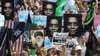 Iran -- Protestors hold anti-US posters as they demonstrate after Friday prayers against a film mocking Islam, in Tehran, 14Sep2012