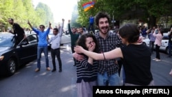 Protesters celebrate at an antigovernment rally in central Yerevan on April 23.