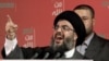 Lebanon -- Hezbollah leader Sheik Hassan Nasrallah gestures as he delivers a speech to his supporters during a Hezbollah 'Victory over Israel' rally, in Beirut's bombed-out suburbs, 22Sep2006
