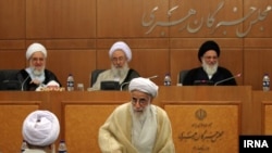 Guardian Council members; Mahmoud Hashemi Shahroudi (R), and Ahmad Jannati (C), attending a session of Assembly of Experts in 2015.