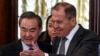 Russian Foreign Minister Sergei Lavrov (right) shows the way to Chinese counterpart Wang Yi during a meeting in Moscow on April 5.