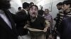 A relative of one of the victims of the attack reacts at a local hospital in Peshawar on February 13.