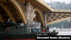 Hungarian efforts to recover bodies have been hampered by high water levels.