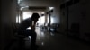 Silhouette of a crying man waiting for his wife or family in the hospital about emergency accident or Deadly disease