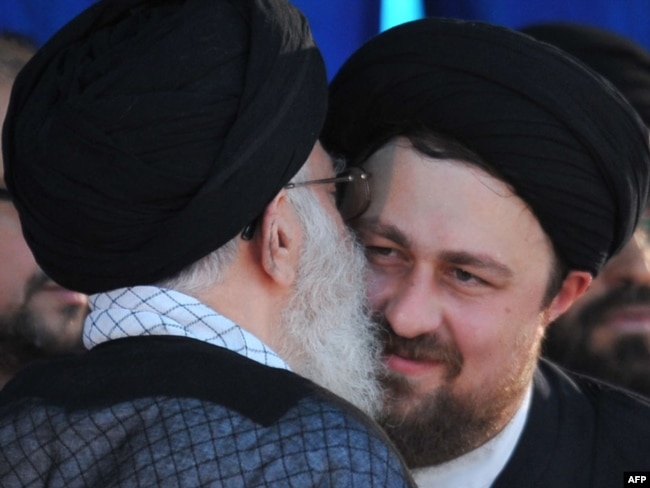Supreme leader Ayatollah Ali Khamenei (L) kisses Hassan Khomeini, grandson of the founder of Islamic Republic, Ayatollah Ruhollah Khomeini during the 21st anniversary of Khomeini's death. Tehran, June 4, 2010