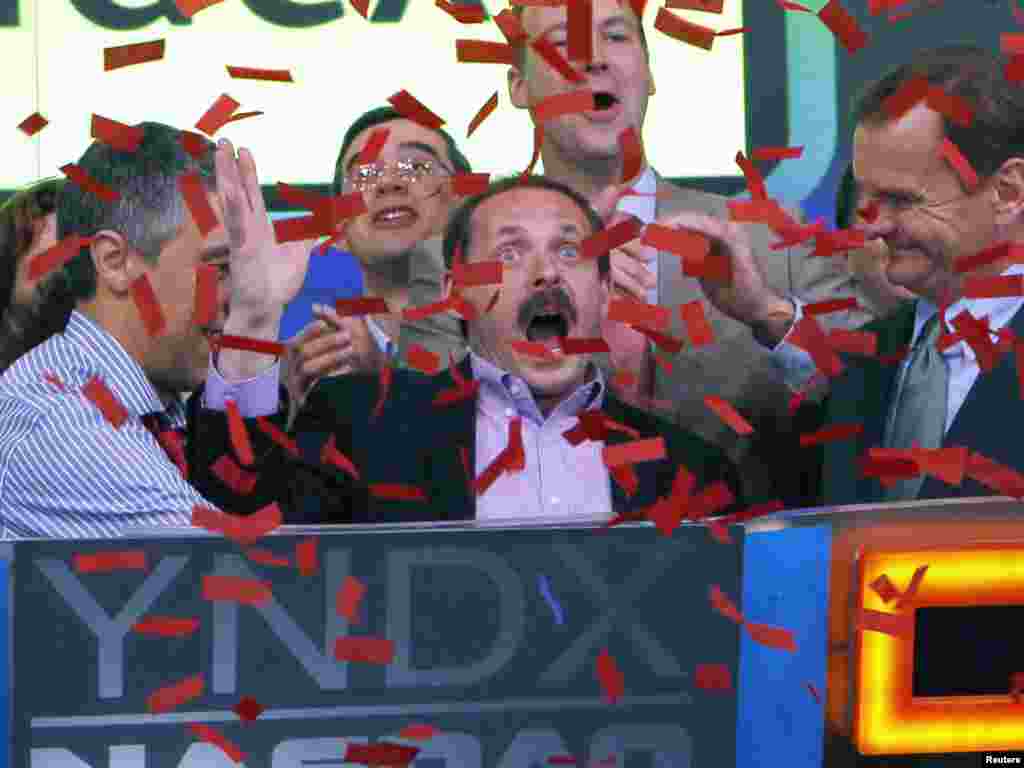 Yandex founder and CEO Arkady Volozh (center) celebrates as Yandex is listed on the Nasdaq exchange during their IPO at the Nasdaq market site in New York on May 24. Photo by Mike Segar for Reuters