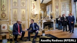 U.S. President Donald Trump and French President Emmanuel Macron meet at Elysee presidential palace.
