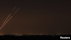 Rockets are seen in the night sky after they were launched from the northern Gaza Strip toward Israel on November 20.