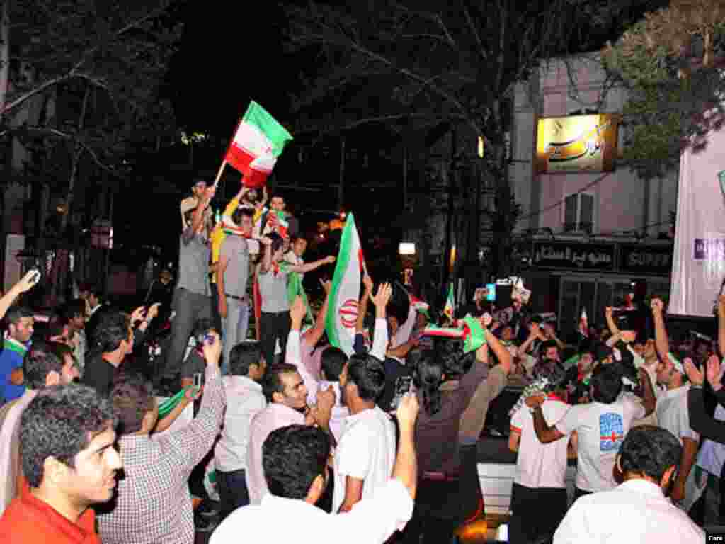 Ahmadinejad supporters celebrate early reports of a lead in the polls.