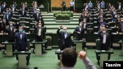 Iranian MPs listen to the speech of Supreme Leader, Ayatollah Ali Khamenei, on Sunday, July 12, 2020. 