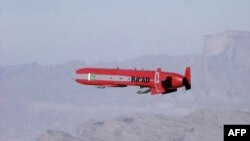 A Pakistani nuclear-capable Ra'ad cruise missile after being launched from a jet fighter during a test firing at an undisclosed location in Pakistan, unadted