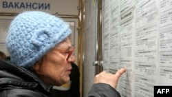 A woman looks at job listings in Kemerovo during a job fair in November.