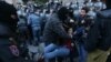 Armenia - Police use force against opposition protesters blocking the entrance to a government building in Yerevan, 19 April 2018.