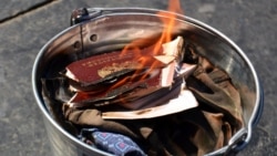 UKRAINE – Russians Mikhail Kuznetsov and Mira Kuznetsova, who lived in St. Petersburg, burned their passports of citizens of the Russian Federation in protest against Russia's aggression against Ukraine. Lviv, May 6, 2014