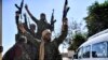 Members of the Syrian Democratic Forces (SDF), backed by U.S. special forces, celebrate at the front line in Raqqa on October 16.