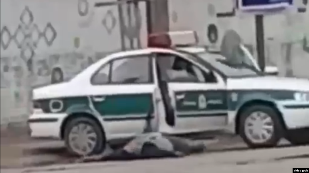 A gunman wounded on the ground after shooting a policeman in the city of Shadehgan, Iran. December 3, 2019