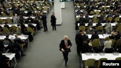 Russia's Ambassador to the UN Vitaly Churkin (center) leaves the General Assembly after a vote on a draft resolution on the territorial integrity of Ukraine.
