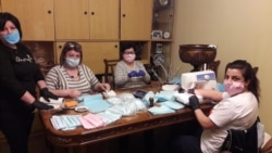 Face masks being produced by (left to right) Irina Khachatrian, Gayane Abrahamian, Raya Khachaturian, and Diana Abrahamian in the Abrahamian dining room.