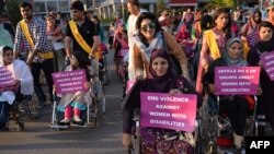 Pakistani activists hold placards as they march during a rally to mark International Women's Day in Islamabad on March 8.