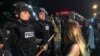 U.S. -- Police gather around protestors following the fatal police shooting of a black man, with a dozen officers and several demonstrators injured in the violence on September 20, 2016 in Charlotte, North Carolina. Media reported that several hundred peo