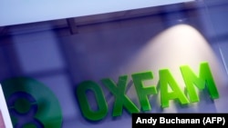 "Oxfam" уюмунун эн белгиси.